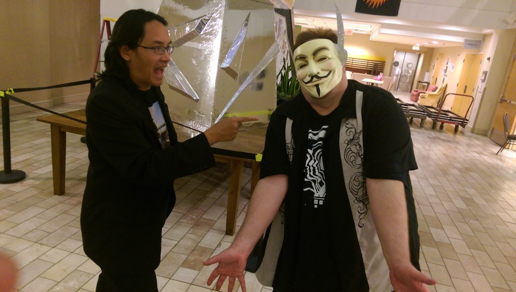 Bryan Thao Worra takes the mask from Chris