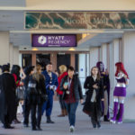 Cosplayers and convention attendees in the skyway connecting the Hyatt Regency and Millennium hotels