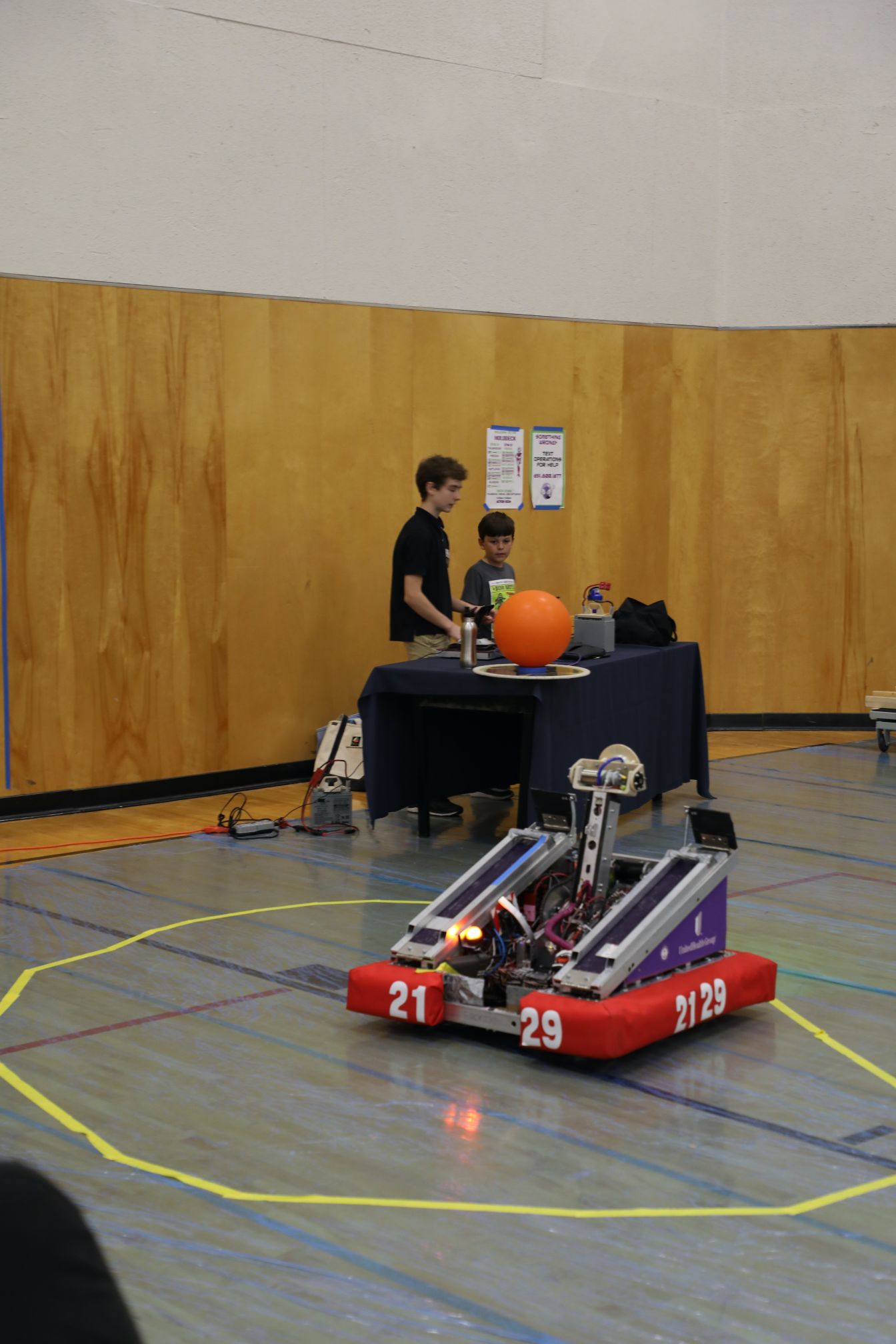 Kids controlling a combat robot