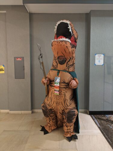 CONvergence 2021 cosplayer in t-rex Loki costume