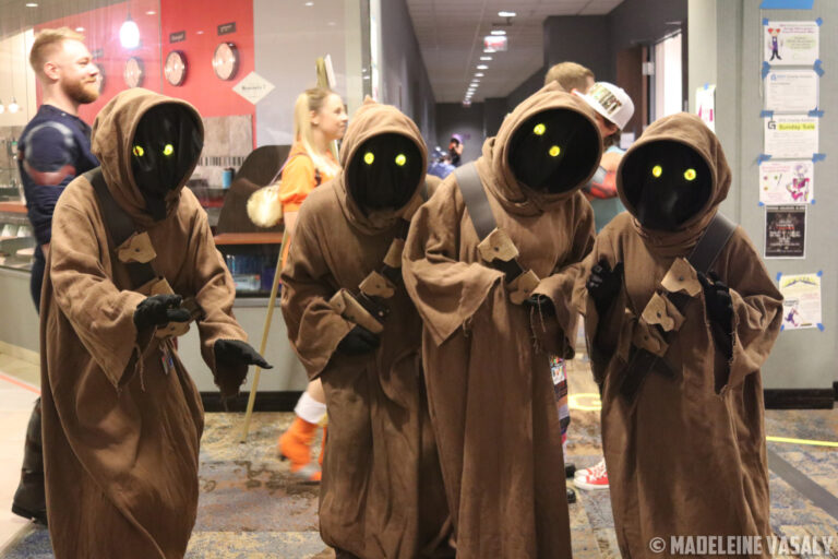 4 Jawas peer curiously at the camera during CONvergence 2019